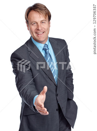 Studio portrait, businessman and hand shake with suit, focus and deal in leadership by white background. Happy corporate leader, motivation or isolated for shaking hands, welcome and company vision 129706387