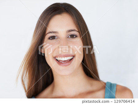 Happy, portrait and woman in studio for makeup, grooming and self care on white background. Face, girl and skin model relax after luxury, treatment and hygiene routine and cosmetics while isolated 129706414