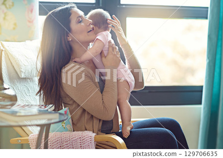 Mother, bonding or hugging baby girl in house living room or family home nursery in support trust, love or security. Mom, infant or child embrace in sleeping help, stop crying or burping after eating Mother, bonding or hugging baby girl in house living room or family home nursery in support trust, love or security. Mom, infant or child embrace in sleeping help, stop crying or burping after eating 129706635