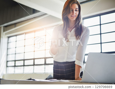 Laptop, coffee and business woman in office reading email in workplace. Tea, computer and happy female employee holding espresso while working, looking at report or advertising proposal in company. Laptop, coffee and business woman in office reading email in workplace. Tea, computer and happy female employee holding espresso while working, looking at report or advertising proposal in company. 129706669