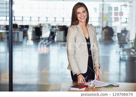 Documents, portrait and business woman in office workplace. Ceo, boss and female employee with paperwork on desk or table planning marketing project, sales report or advertising proposal in company. Documents, portrait and business woman in office workplace. Ceo, boss and female employee with paperwork on desk or table planning marketing project, sales report or advertising proposal in company. 129706679