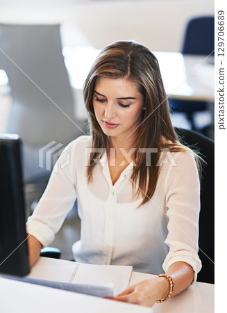 Business, woman and reading with focus, planning schedule and administrator with report, feedback and sales charts. Female employee, work and entrepreneur with paperwork, documents and admin update 129706689