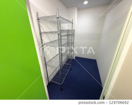 A small room equipped with steel racks A small room equipped with steel racks 129706692
