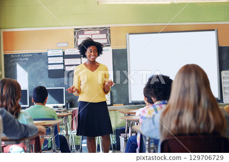 African woman, teacher and classroom discussion with students for education, learning support and knowledge development. Happy black female, preschool classroom and tutor teaching young children African woman, teacher and classroom discussion with students for education, learning support and knowledge development. Happy black female, preschool classroom and tutor teaching young children 129706729