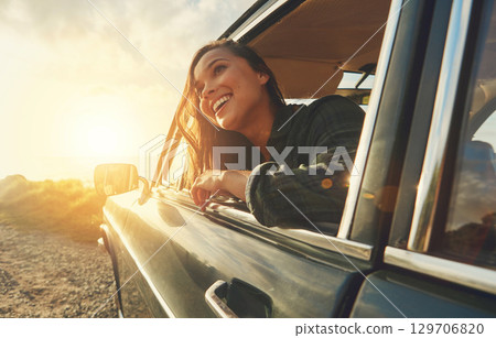 Thinking, travel and road trip with a black woman in a car at sunset during summer vacation or holiday. Nature, window and drive with an attractive young female sitting in transport for adventure Thinking, travel and road trip with a black woman in a car at sunset during summer vacation or holiday. Nature, window and drive with an attractive young female sitting in transport for adventure 129706820