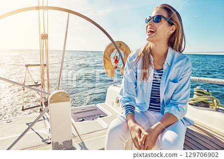 Travel, cruise and woman on yacht for holiday, summer vacation and weekend getaway in Italy. Travelling lifestyle, ocean adventure and happy lady with sunglasses smile, relax and enjoy boat trip 129706902