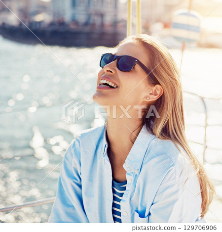 Ocean, cruise and woman on yacht for holiday, summer vacation and weekend getaway in Italy. Travelling lifestyle, sea adventure and happy girl with sunglasses smile, relaxing and enjoying boat trip 129706906