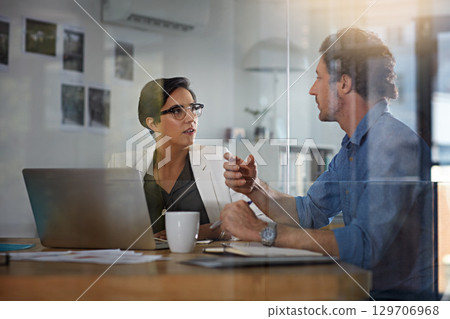 Training, planning and business people in a meeting for a partnership, discussion and brainstorming on a laptop. Teamwork, web design and employees talking about a plan for a website on a pc 129706968