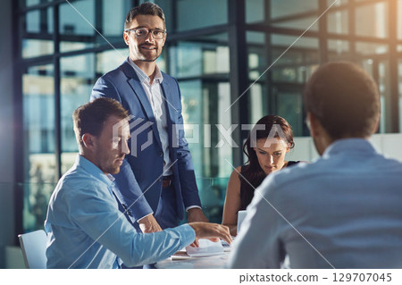 Business people, office and meeting for strategy, planning and success with teamwork, vision and leader. Businessman, leadership and group at desk with woman, black man and documents for innovation Business people, office and meeting for strategy, planning and success with teamwork, vision and leader. Businessman, leadership and group at desk with woman, black man and documents for innovation 129707045