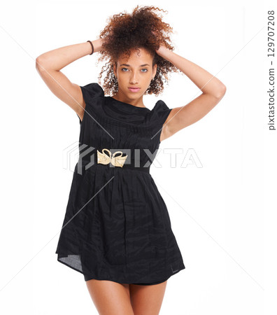 Fashion, beauty and portrait of a black woman with natural hair on white background wearing a black dress. Young female model posing with free space for marketing and advertising cosmetics or clothes 129707208