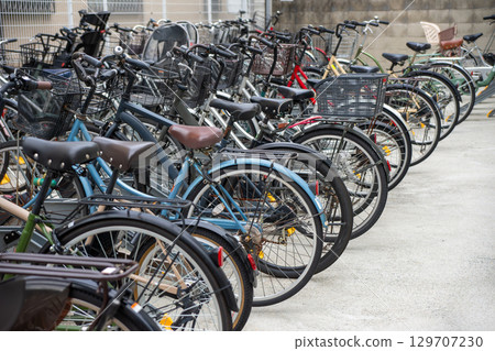Bicycles in the bicycle parking lot in front of the station 129707230