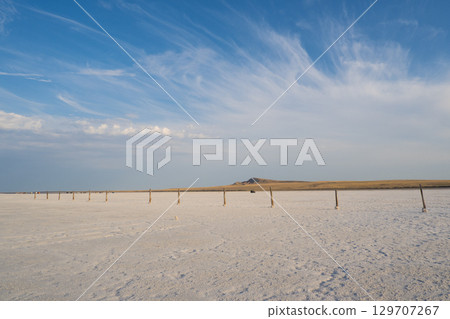 Landscape of the salt lake Baskunchak. View of Mount Big Bogdo. Astrakhan region, Russia 129707267