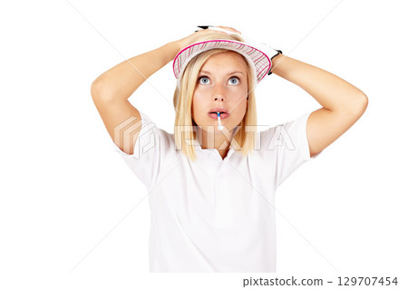 Golf, mistake and game with a sports woman in studio isolated on a white background looking worried. Shocked, surprised and biting a tee with a female golfer standing hands on head on blank space 129707454