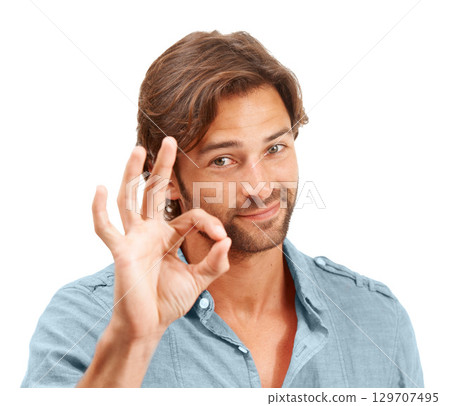 Man, face and OK hand sign with portrait, agreement or good review, feedback and emoji against studio background. Yes gesture, success and vote with approval and male voice positive opinion 129707495