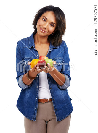 Portrait, fruits or black woman with an orange or apple in studio on white background for healthcare or vegan diet. Smile, wellness or healthy African girl model happy with organic food or vitamin c Portrait, fruits or black woman with an orange or apple in studio on white background for healthcare or vegan diet. Smile, wellness or healthy African girl model happy with organic food or vitamin c 129707571
