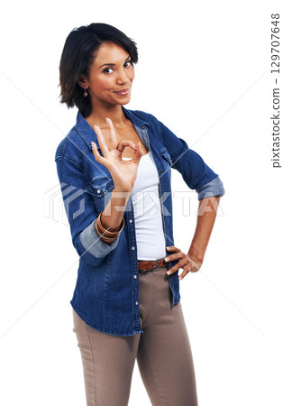 Hand sign, ok meme and portrait of woman with smile on face, agreement and understanding isolated on white background. Motivation, approval and good job finger gesture, happy woman standing in studio 129707648
