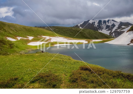 Mountain lake in highlands. 129707759