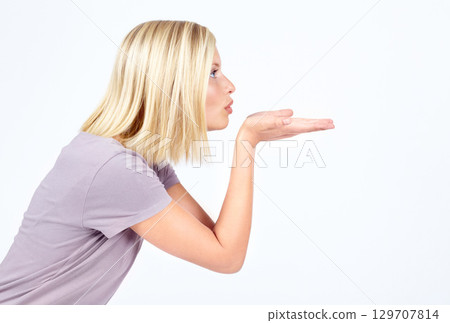 Flirting profile and air kiss of girl contemplating, thinking and thoughtful for advertising. Attractive flirt and affection of isolated model blowing kisses on white background mock up. 129707814