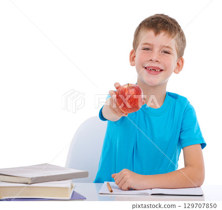 Education books, child portrait and apple for health nutrition, studio learning or school math homework. Nutritionist food, student study snack and kid boy show fruit isolated on white background 129707850