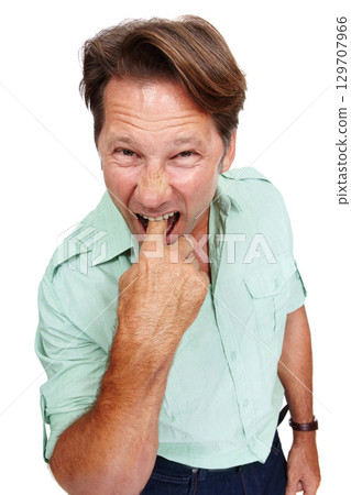 Portrait, gross and nausea with a man model in studio isolated on a white background feeling ill or sick. Face, finger and mouth with a male standing on blank space in disgust or expressing turn off 129707966