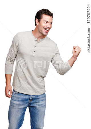Happy, man and promotion in celebration for winning, discount or goal against a white studio background. Isolated male model winner with smile celebrating win, sale or achievement on mockup 129707994