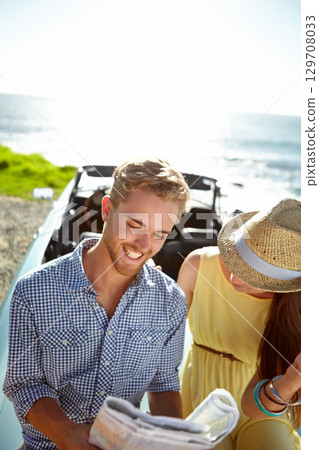Road trip, adventure and couple with map by ocean on summer holiday, vacation and weekend getaway on car. Travelling, freedom and man and woman reading paper for directions, navigation and journey Road trip, adventure and couple with map by ocean on summer holiday, vacation and weekend getaway on car. Travelling, freedom and man and woman reading paper for directions, navigation and journey 129708033