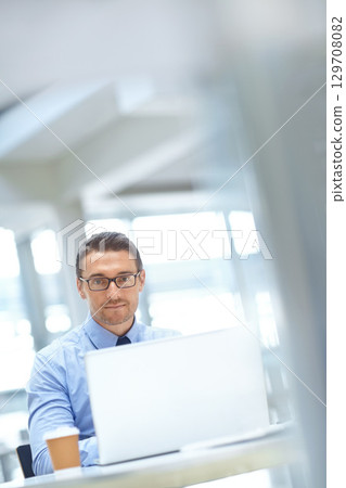 Portrait, corporate or business man with laptop for invest strategy, finance growth or financial network. CEO, tech or manager in office for planning, data analysis or economy data analytics review 129708082