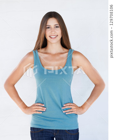 Fashion, beauty and portrait of woman on a white background with trendy, stylish and casual clothes. Confidence, attitude and girl fashion model isolated in studio in urban, retro and summer style Fashion, beauty and portrait of woman on a white background with trendy, stylish and casual clothes. Confidence, attitude and girl fashion model isolated in studio in urban, retro and summer style 129708106