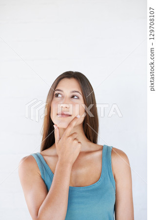 Hand, woman and thinking in studio with an idea, vision and decision on white background space. Ideas, choice and girl planning, pensive and thoughtful while standing, contemplate and isolated Hand, woman and thinking in studio with an idea, vision and decision on white background space. Ideas, choice and girl planning, pensive and thoughtful while standing, contemplate and isolated 129708107