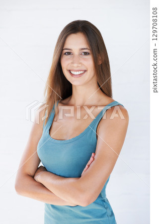 Beauty, fashion and portrait of woman on a white background with trendy, stylish and casual clothes. Confidence, smile and girl fashion model isolated in studio in retro and summer style 129708108