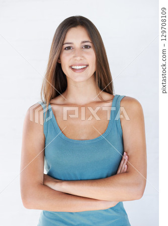 Smile, fashion and portrait of woman on a white background with trendy, stylish and casual clothes. Confident attitude, beauty and girl fashion model isolated in studio in urban, retro and cool style 129708109