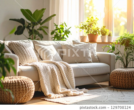 A cozy living room with houseplants and natural light 129708124