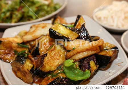 Stir-fried Potatoes, Eggplant, and Peppers. Chinese food 129708131