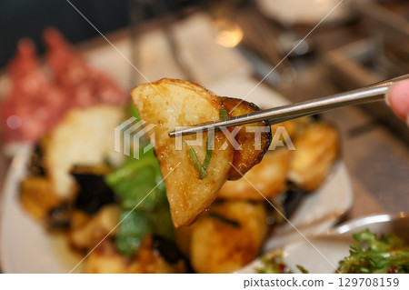 Stir-fried Potatoes, Eggplant, and Peppers. Chinese food 129708159