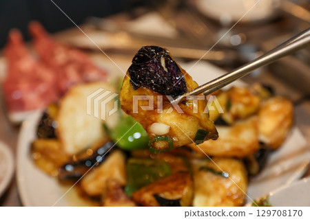 Stir-fried Potatoes, Eggplant, and Peppers. Chinese food 129708170