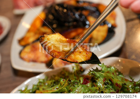 Stir-fried Potatoes, Eggplant, and Peppers. Chinese food 129708174