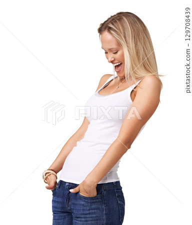 Happy, smile and mockup with a woman in studio on a white background standing hands in pockets in casual clothing. Style, clothes and an excited young female posing in denim jeans and a tank top Happy, smile and mockup with a woman in studio on a white background standing hands in pockets in casual clothing. Style, clothes and an excited young female posing in denim jeans and a tank top 129708439