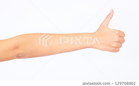 Woman, hand and thumbs up on studio background in success goals, vote support or opinion on white mockup backdrop. Zoom, model and yes finger gesture in thank you, winner news or good luck motivation Woman, hand and thumbs up on studio background in success goals, vote support or opinion on white mockup backdrop. Zoom, model and yes finger gesture in thank you, winner news or good luck motivation 129708802