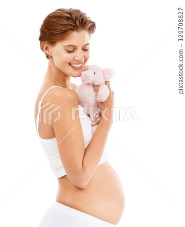 Pregnancy, baby teddy bear and happy woman with love and big stomach smile with child toy. Mothers love, pig doll and pregnant mama happiness with excited with about child care, motherhood and family Pregnancy, baby teddy bear and happy woman with love and big stomach smile with child toy. Mothers love, pig doll and pregnant mama happiness with excited with about child care, motherhood and family 129708827