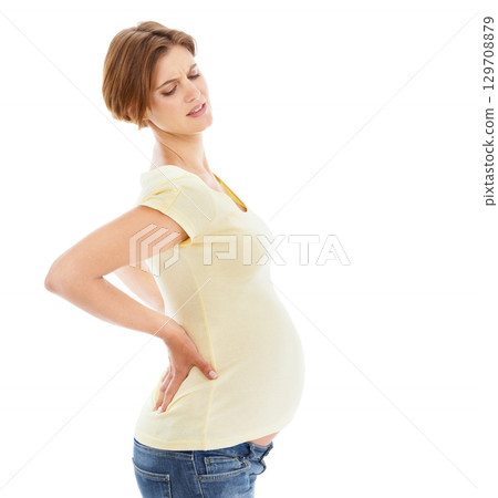 Woman, pregnant and back pain in studio by white background with frustrated face, hands and massage. Pregnant woman, future mother and stomach with injury, backache or isolated self care for wellness 129708879