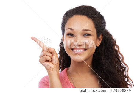 Young black girl, smile portrait and point finger for advertising mockup, marketing and branding in white background. Person, happy face and gesture, happiness and product placement space in studio 129708889