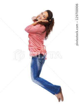 Music headphones, portrait and woman jump in studio isolated on a white background mock up. Jumping, energy and happy female with hifi headset streaming, listening or enjoying podcast, radio or audio Music headphones, portrait and woman jump in studio isolated on a white background mock up. Jumping, energy and happy female with hifi headset streaming, listening or enjoying podcast, radio or audio 129708906