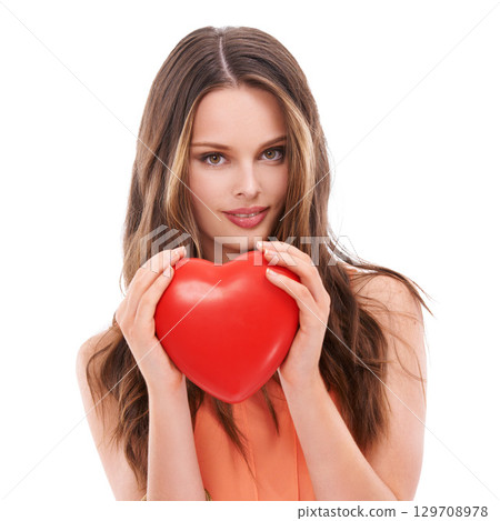 Face portrait, heart balloon and woman in studio isolated on white background. Love, affection and young female model holding symbol for romance, valentines passion or romantic emoji, care or empathy 129708978