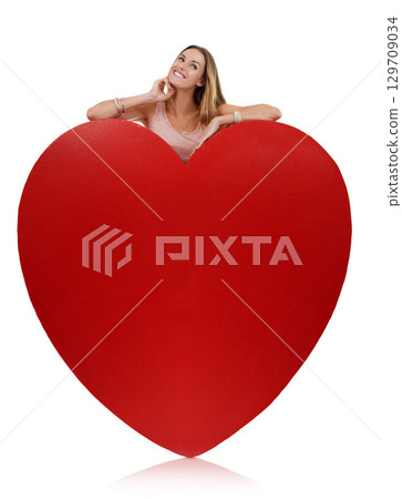 Heart, in love and woman happy with freedom and funny excited feeling behind sign. Model, white background and comic young person with happiness, joy and smile for romance and beauty isolated 129709034