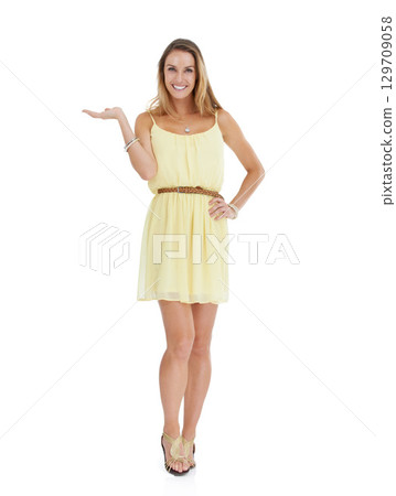 Woman, studio portrait and marketing hand with smile, yellow fashion dress and white background. Isolated young model, clothes and happy with copy space, beauty and product placement with open palm Woman, studio portrait and marketing hand with smile, yellow fashion dress and white background. Isolated young model, clothes and happy with copy space, beauty and product placement with open palm 129709058