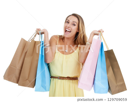 Shopping bag, portrait and woman excited in studio, isolated white background and retail mall sales. Happy customer, model and shopping in commerce market, discount promotion and luxury store brand 129709059