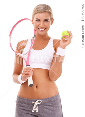Tennis girl, studio portrait and racket with tennis ball for health, sports and wellness by white background. Happy tennis player woman, focus and mindset while isolated for training, fitness or goal Tennis girl, studio portrait and racket with tennis ball for health, sports and wellness by white background. Happy tennis player woman, focus and mindset while isolated for training, fitness or goal 129709200