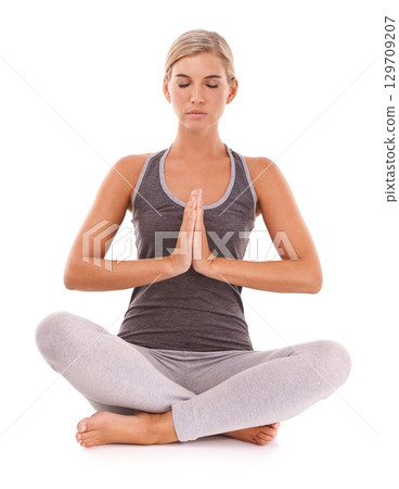 Yoga meditation, wellness and relax woman meditate for pilates healthcare, spiritual soul aura or chakra energy healing. Namaste, zen mindset peace and model mindfulness on white background studio 129709207