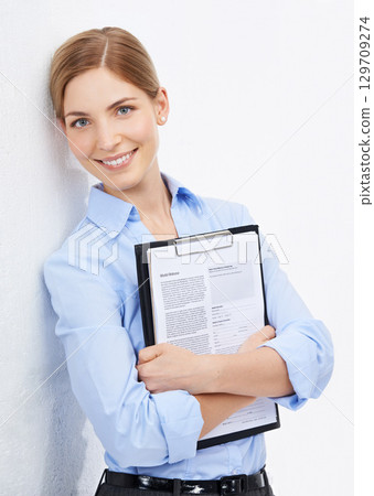 Portrait, documents and mockup with a business woman in studio on a white background for a research review. Marketing, advertising or contract with a female employee holding a survey or questionnaire 129709274