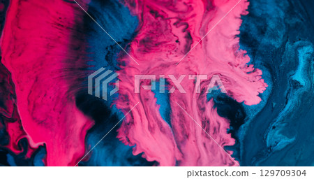 Paint spatter. Flow color water. Defocused blue pink purple liquid dark black texture pour on abstract marble creative background. 129709304